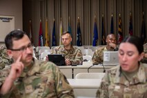 U.S. Air Force Col. William J. Watkins, center left, 22nd Air Task Force (ATF) commander, in-processes in preparation for Exercise Northern Strike 25-2 (NS 25-2) at Fort Custer, Michigan, Aug. 3, 2025.