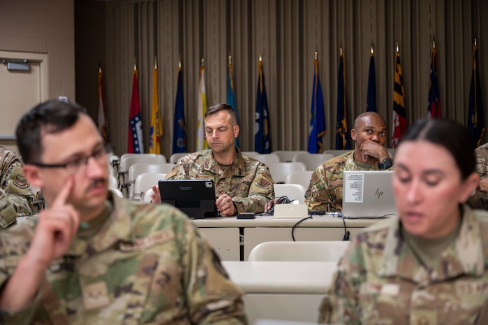 U.S. Air Force Col. William J. Watkins, center left, 22nd Air Task Force (ATF) commander, in-processes in preparation for Exercise Northern Strike 25-2 (NS 25-2) at Fort Custer, Michigan, Aug. 3, 2025.