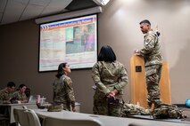 U.S. Air Force Chief Master Sgt. Erick Lizarraga, right, 22nd Air Task Force (ATF) command chief, speaks to in-processing personnel in preparation for Exercise Northern Strike 25-2 (NS 25-2) at Fort Custer, Michigan, Aug. 3, 2025.