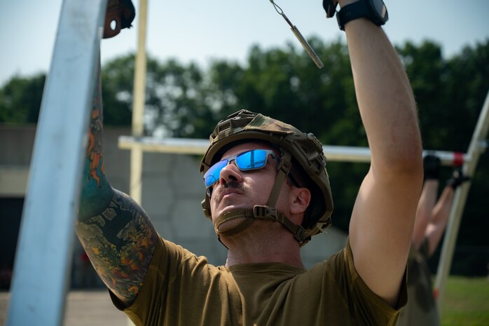U.S. Air Force Tech. Sgt. William Campbell, 92nd Civil Engineer Squadron assistant chief, assigned to the 22nd Air Task Force (ATF) assists in tent build-up as part of the advanced echelon (ADVON) team in preparation for Exercise Northern Strike 25-2 (NS 25-2) at Battle Creek Air National Guard Base, Michigan, Aug. 2, 2025.