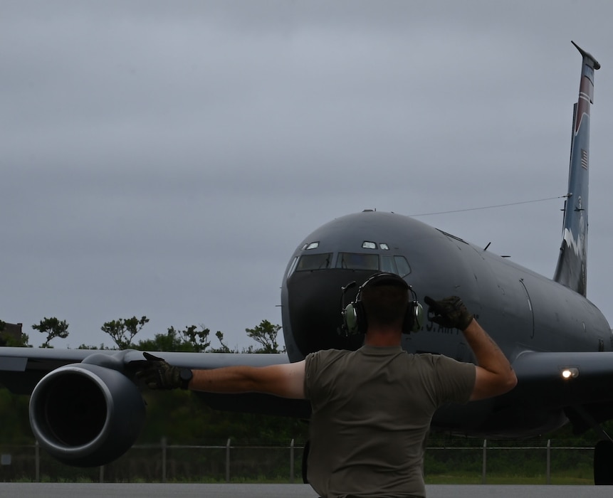 An Airman marshals a KC-135 Stratotanker from the Utah Air National Guard's 151st Air Refueling Wing during Resolute Force Pacific 25 in the Indo-Pacific region, July 24, 2025.