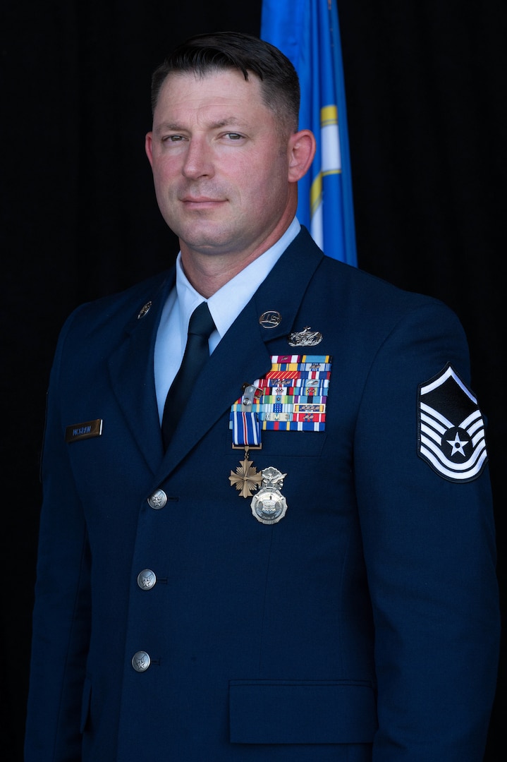 U.S. Air National Guard Master Sgt. Keith McGraw, Phoenix Raven, poses after receiving the Distinguished Flying Cross with “C” Device assigned to the 130th Airlift Wing, Charleston, West Virginia, Aug. 3, 2025. McGraw was awarded the DFC for his distinctive heroism and extraordinary achievement while participating in aerial flight on August 30, 2021 in and over Kabul, Afghanistan in support of Operation Allies Refuge. Operation Allies Refuge was the largest non-combatant evacuation operation in American history where more than 120,000 Afghan citizens were assisted by Airmen. (U.S. Air National Guard photo by Staff Sgt. Alancea Grant)