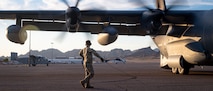 A U.S. Air Force Air Commando assigned to AFSOC conducts engine startup checks on a MC-130J Commando II aircraft during Emerald Warrior 25.2.