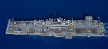 Sailors assigned to the forward-deployed amphibious assault ship USS America (LHA 6) and U.S. Marines with the 31st Marine Expeditionary Unit stand in formation for a photo commemorating 250 years of naval service, while conducting operations in the Coral Sea, Aug. 2.