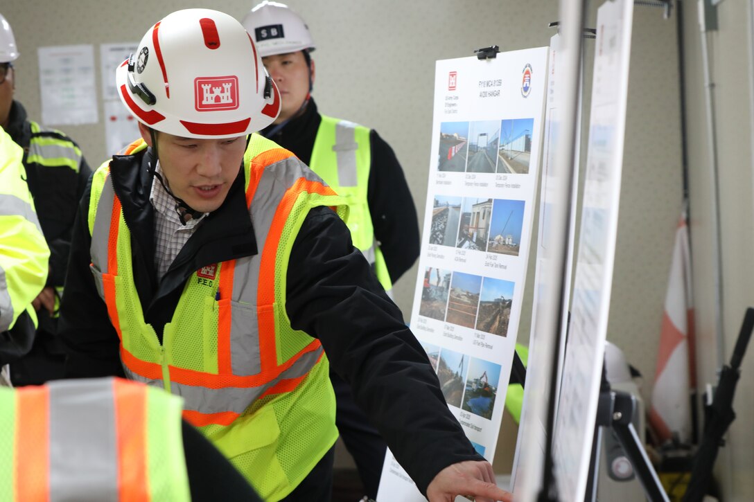 So Lee, recently named the U.S. Army Corps of Engineers (USACE) Project Manager of the Year, provides a briefing on the AV200 Hangar at U.S. Army Garrison Humphreys to senior leaders from the USACE Pacific Ocean Division, April 14, 2025. Recognized for his leadership and consistent delivery of high-impact projects, Lee plays a key role in managing critical infrastructure in the region. (US Army photo by Monique Freemon)