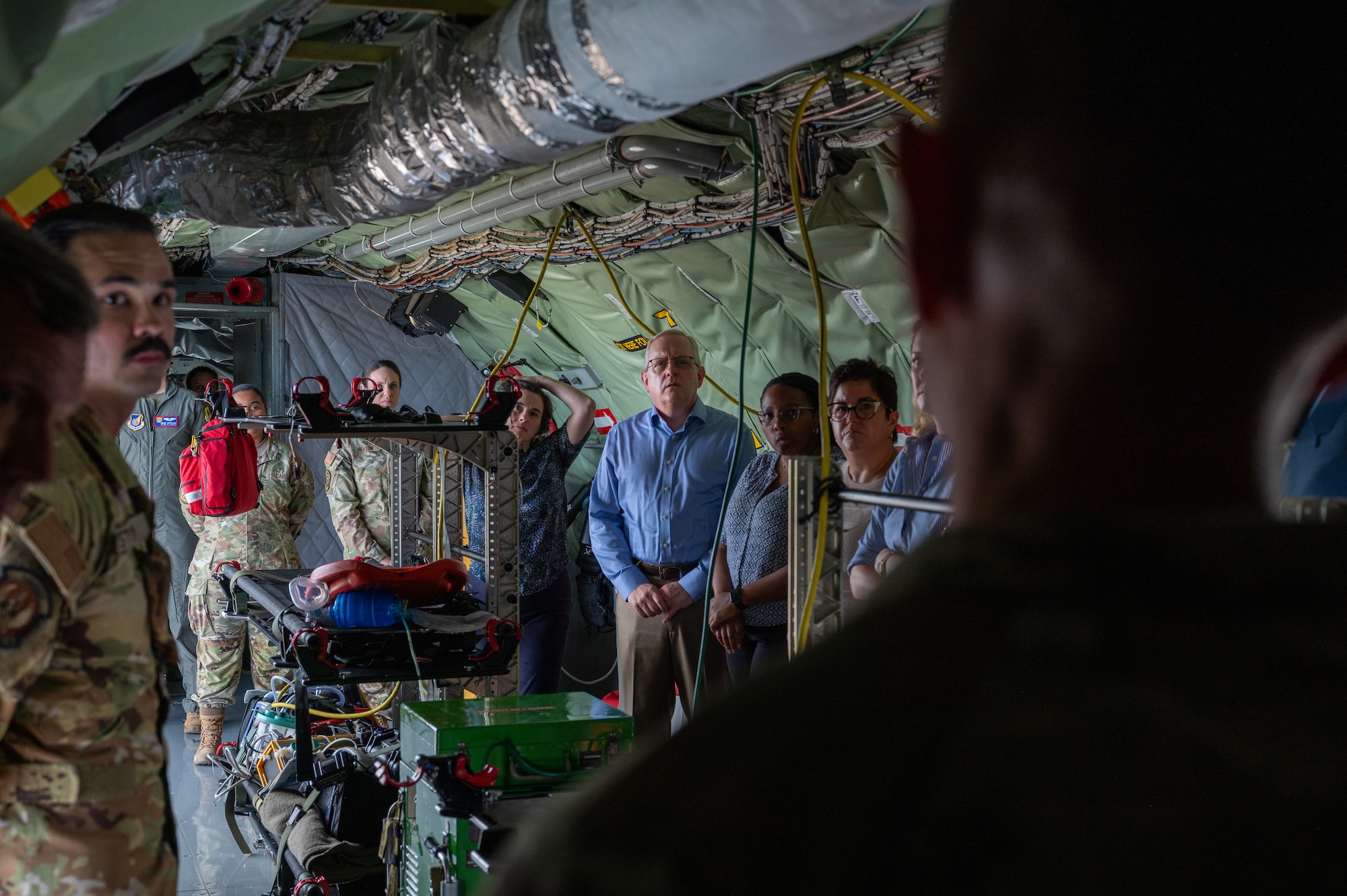 House Armed Services Committee members are briefed by an 18th Aeromedical Evacuation Squadron Airman