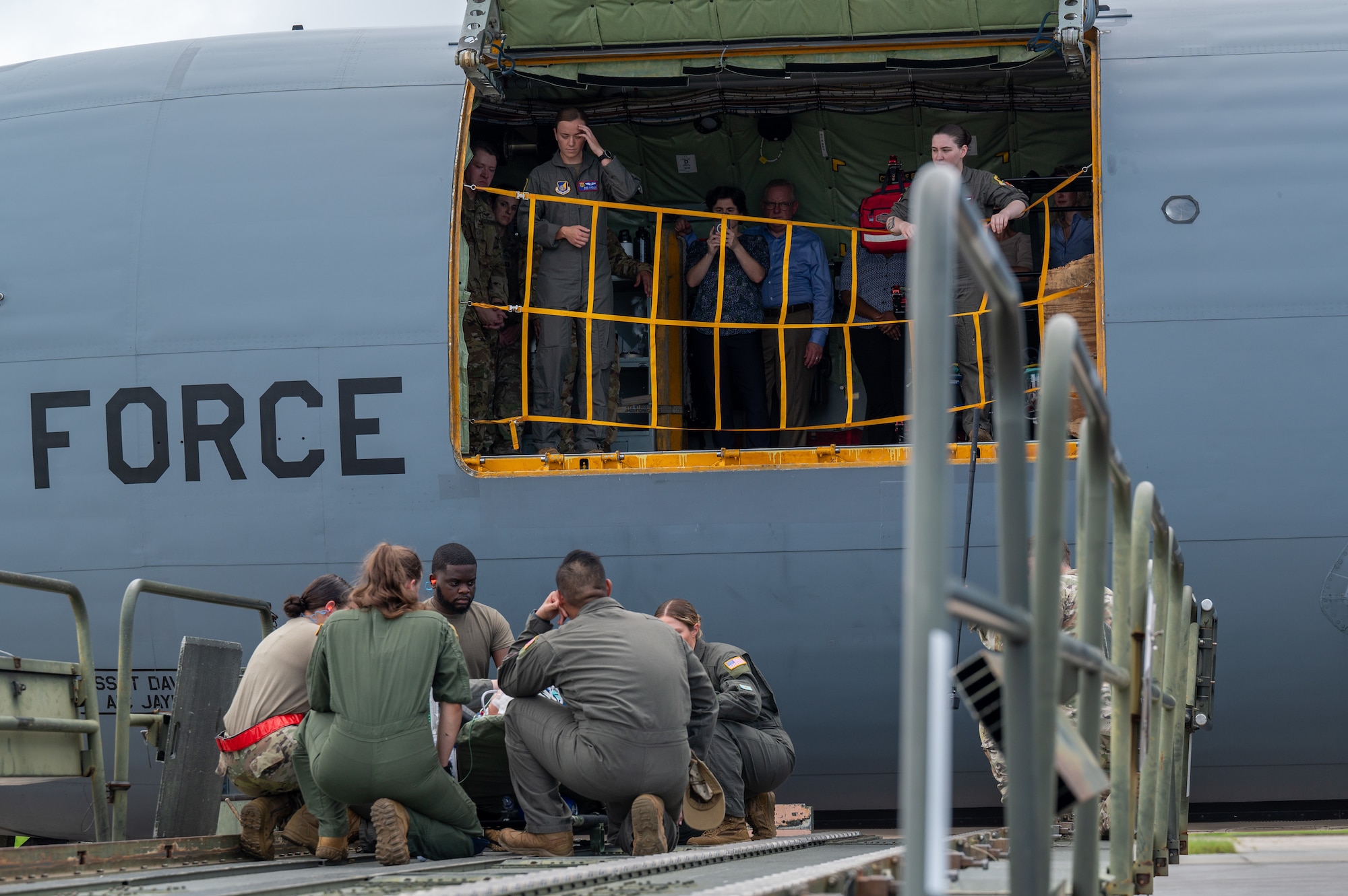 House Armed Services Committee members observe a patient extraction demonstration