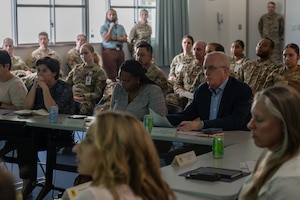 House Armed Services Committee members attend a brief by the 18th Medical Group