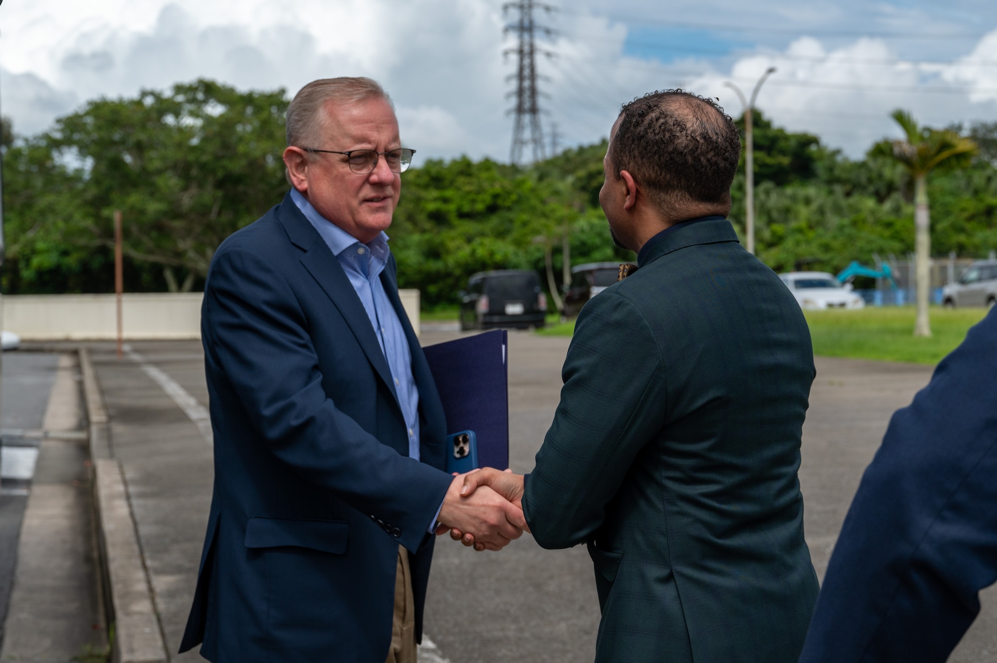 House Armed Services Committee member is greeted by a DODEA Pacific chief of staff