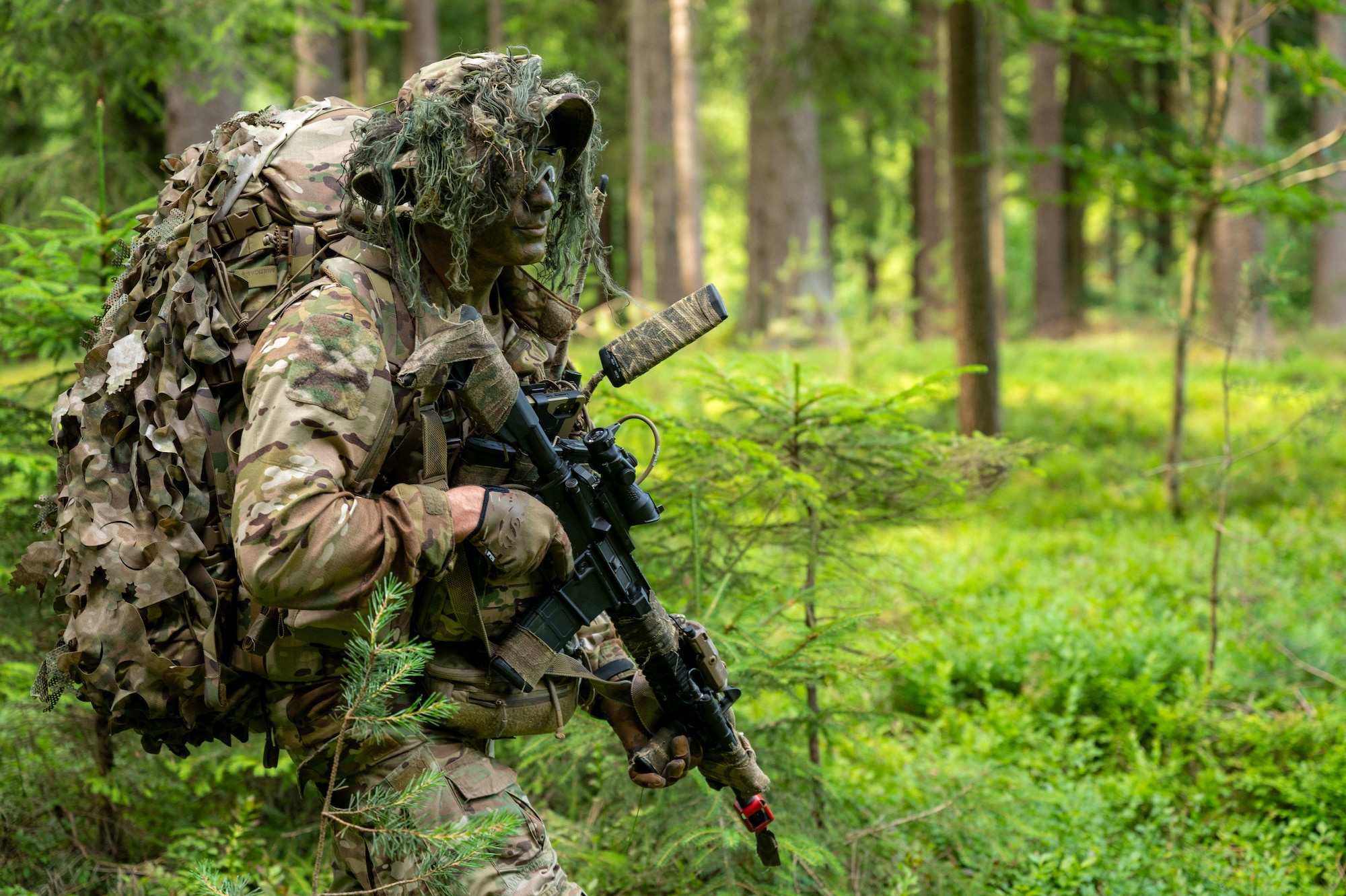 A U.S. Air Force Airman assigned to the 2nd Air Support Operations Squadron patrols during a reconnaissance mission at a training area near Vilseck Army Base, Germany, July 15, 2025.