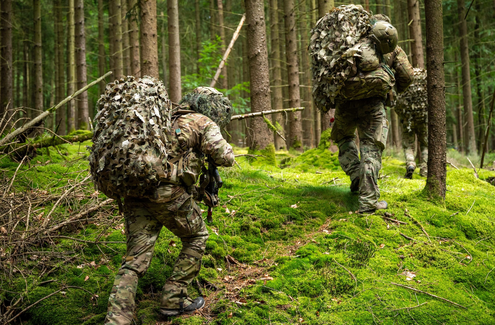 U.S. Air Force Airmen assigned to the 2nd Air Support Operations Squadron patrol during reconnaissance training at a training area near Vilseck Army Base, Germany, July 15, 2025.