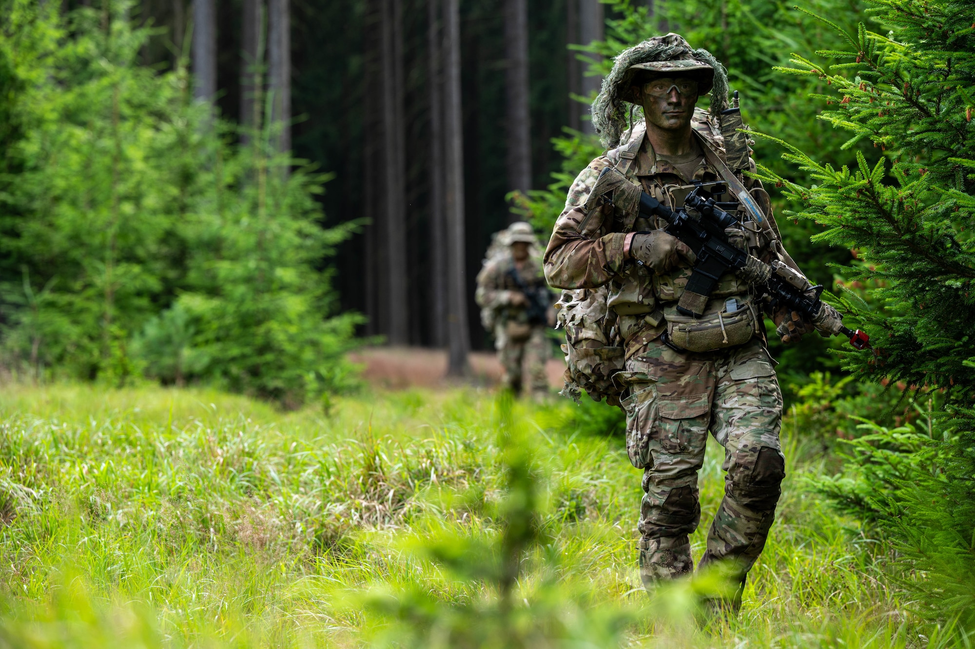 U.S. Air Force Airmen assigned to the 2nd Air Support Operations Squadron patrol during a training reconnaissance mission at a training area near Vilseck Army Base, Germany, July 15, 2025.