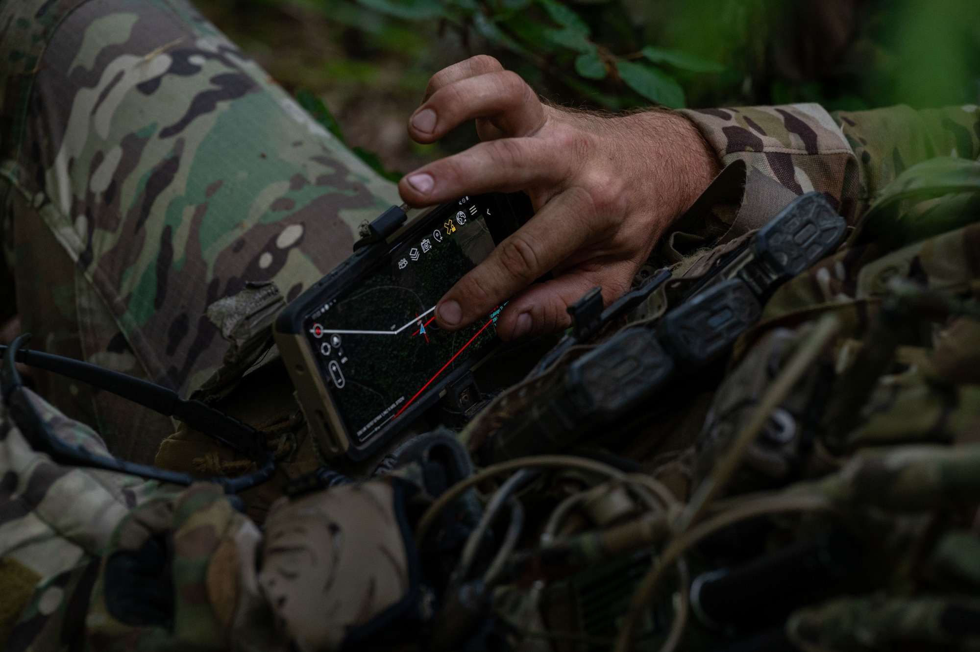 A U.S. Air Force Airman assigned to the 2nd Air Support Operations Squadron monitors GPS locations of other team members during a training reconnaissance mission at a training area near Vilseck Army Base, Germany, July 15, 2025.