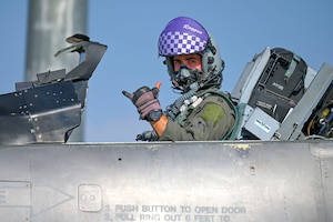 A pilot poses for a photo.