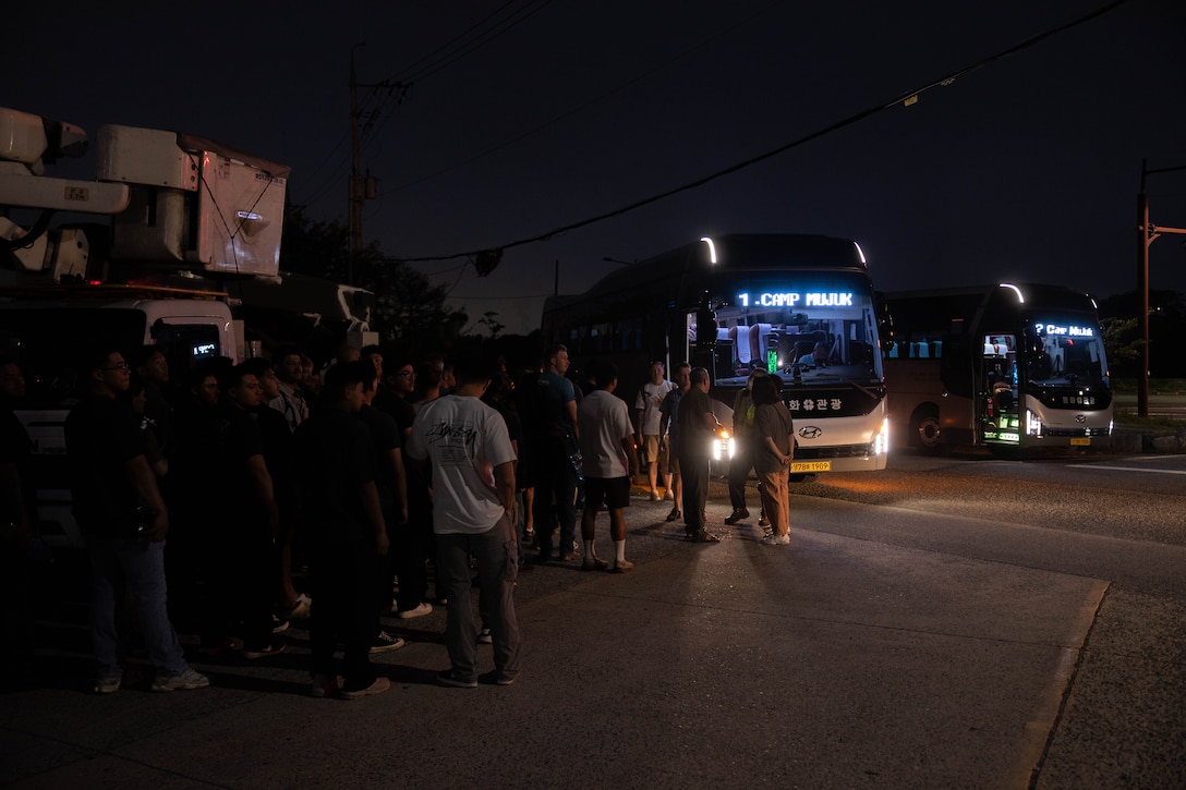 U.S. Marines with 2nd Battalion, 23rd Marines, forward deployed with 4th Marine Regiment, 3rd Marine Division as part of the Unit Deployment Program, prepare to board a bus to the demilitarized zone during the Korean Marine Exercise Program 25.2, on Camp Mujuk, South Korea, Aug. 1, 2025. KMEP is conducted regularly between the ROK and U.S. Marine Corps to increase their combined capabilities through realistic training geared towards deterrence and maintaining peace in the Indo-Pacific.  (U.S. Marine Corps photo by Cpl. Kanoa Thomas)