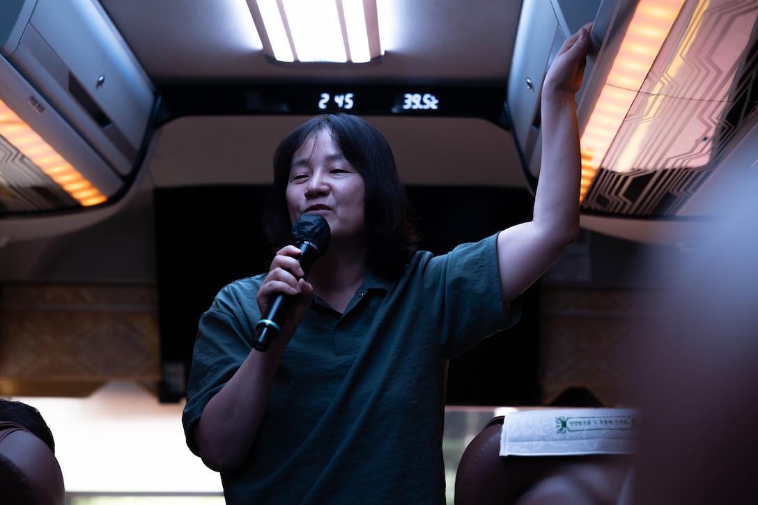Mrs. Lee-Seon Ah, a demilitarized zone tour guide, speaks to U.S. Marines with 2nd Battalion, 23rd Marines, forward deployed with 4th Marine Regiment, 3rd Marine Division as part of the Unit Deployment Program, as part of a DMZ tour during the Korean Marine Exercise Program 25.2, in Paju, South Korea, Aug. 1, 2025. KMEP is conducted regularly between the ROK and U.S. Marine Corps to increase their combined capabilities through realistic training geared towards deterrence and maintaining peace in the Indo-Pacific.  (U.S. Marine Corps photo by Cpl. Kanoa Thomas)