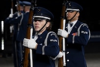 U.S. Air Force Senior Airman Sara Wilson, ceremonial guardsman with the U.S. Air Force Honor Guard, stands at port arms ready to execute a drill sequence during the rehearsal of the 75th Royal Edinburgh Military Tattoo in Edinburgh, Scotland, July 31, 2025.