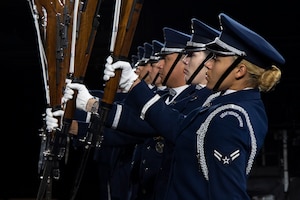 Members of the U.S. Air Force Honor Guard Drill Team conduct a Marine pitchout drill movement during the rehearsal of the 75th Royal Edinburgh Military Tattoo in Edinburgh, Scotland, July 31, 2025.
