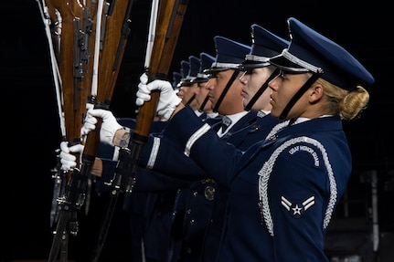 Members of the U.S. Air Force Honor Guard Drill Team conduct a Marine pitchout drill movement during the rehearsal of the 75th Royal Edinburgh Military Tattoo in Edinburgh, Scotland, July 31, 2025.