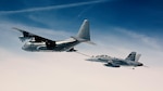 A U.S. Navy Reserve KC-130T refuels an EA-18G Growler in the skies over Naval Air Station Patuxent River in Maryland during testing that enabled the service’s fleet of Hercules aircraft to aerially refuel a significantly expanded number of aircraft in early 2025.