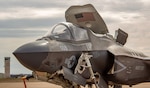 An F-35B Lightning II from Marine Fighter Attack Training Squadron 502, the 'Flying Nightmares,' sits with its canopy open during a training detachment at Naval Air Station Joint Reserve Base Fort Worth, Texas, March 2025. The open hatch facilitates pre-flight checks and pilot preparation as the squadron refines air-to-air and air-to-surface combat skills for operational readiness.