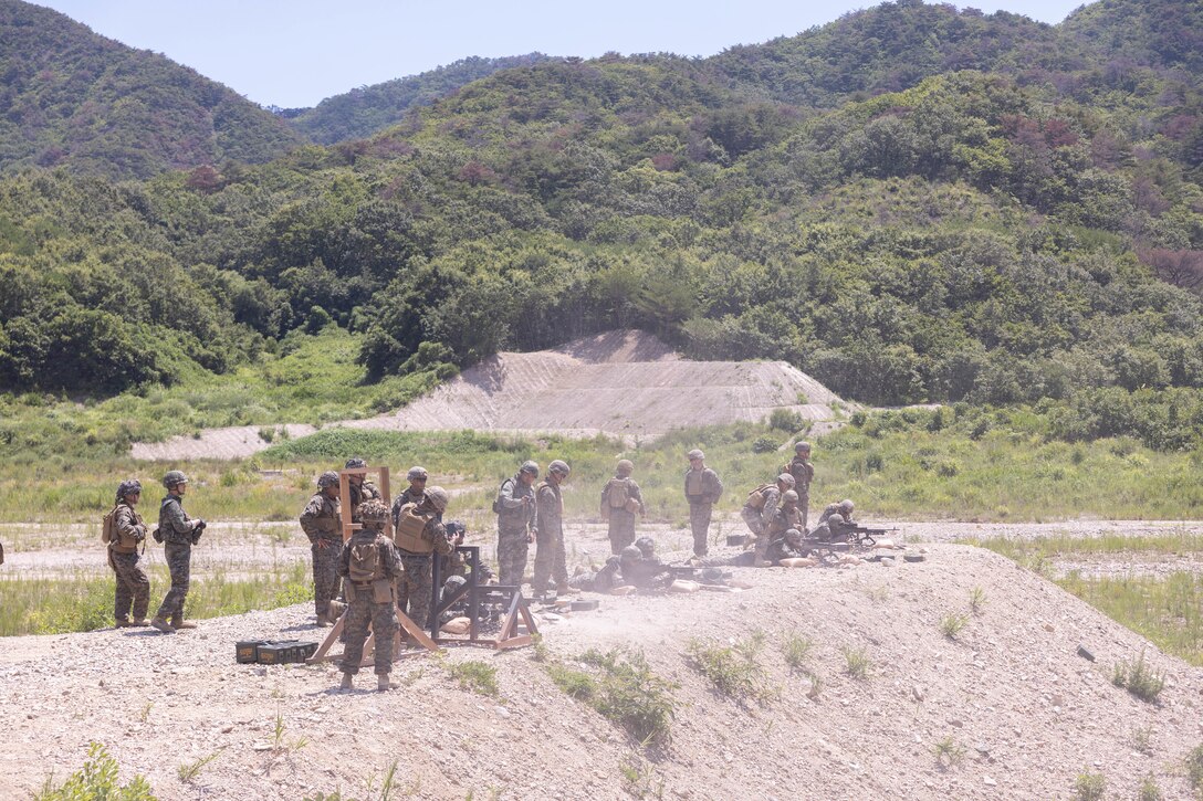 U.S. Marines with 2nd Battalion, 23rd Marines, forward deployed with 4th Marine Regiment, 3rd Marine Division as part of the Unit Deployment Program, fire M240B machine guns during the Korean Marine Exercise Program 25.2 in Suseong-ri, South Korea, July 30, 2025. KMEP is conducted regularly between the ROK and U.S. Marine Corps to increase their combined capabilities through realistic training geared towards deterrence and maintaining peace in the Indo-Pacific. (U.S. Marine Corps photo by Cpl. Kanoa Thomas)