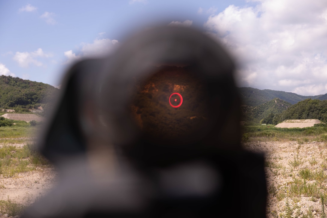 U.S. Marines with 2nd Battalion, 23rd Marines, forward deployed with 4th Marine Regiment, 3rd Marine Division as part of the Unit Deployment Program, look through the optic of an M240B machine gun during the Korean Marine Exercise Program 25.2 in Suseong-ri, South Korea, July 30, 2025. KMEP is conducted regularly between the ROK and U.S. Marine Corps to increase their combined capabilities through realistic training geared towards deterrence and maintaining peace in the Indo-Pacific. (U.S. Marine Corps photo by Cpl. Kanoa Thomas)