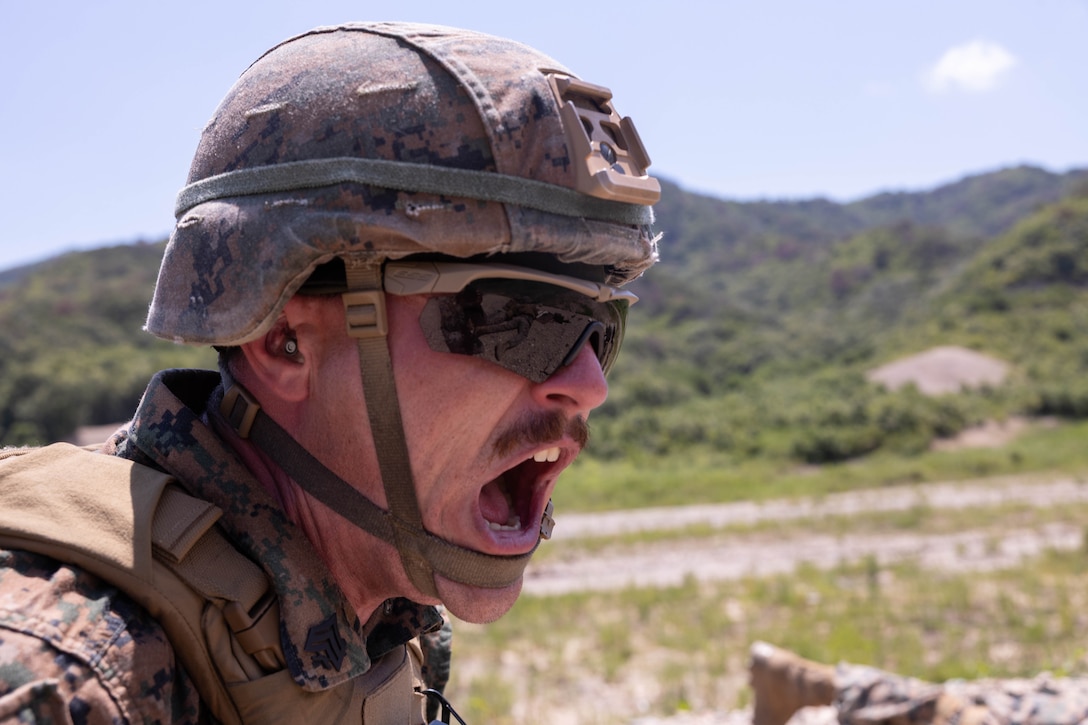 U.S. Marine Corps Sgt. Patrick Behl, a machine gunner with 2nd Battalion, 23rd Marines, forward deployed with 4th Marine Regiment, 3rd Marine Division as part of the Unit Deployment Program, calls out instructions between guns on a crew-served weapons range during the Korean Marine Exercise Program 25.2 in Suseong-ri, South Korea, July 30, 2025. KMEP is conducted regularly between the ROK and U.S. Marine Corps to increase their combined capabilities through realistic training geared towards deterrence and maintaining peace in the Indo-Pacific. Behl is a native of Missouri. (U.S. Marine Corps photo by Cpl. Kanoa Thomas)