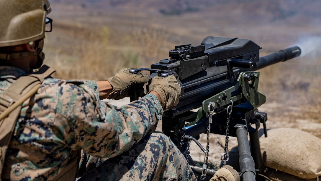 A U.S. Marine with I Marine Expeditionary Force Support Battalion, I MEF Information Group, fires a Mark 19 40 mm grenade machine gun during a Basic Machine Gun Course at Marine Corps Base Camp Pendleton, California, Aug. 1, 2025. Combat Skills Training School provides Marines with practical application to improve basic weapons-handling proficiency. (U.S. Marine Corps photo by Cpl. Ricardo Ramirez)