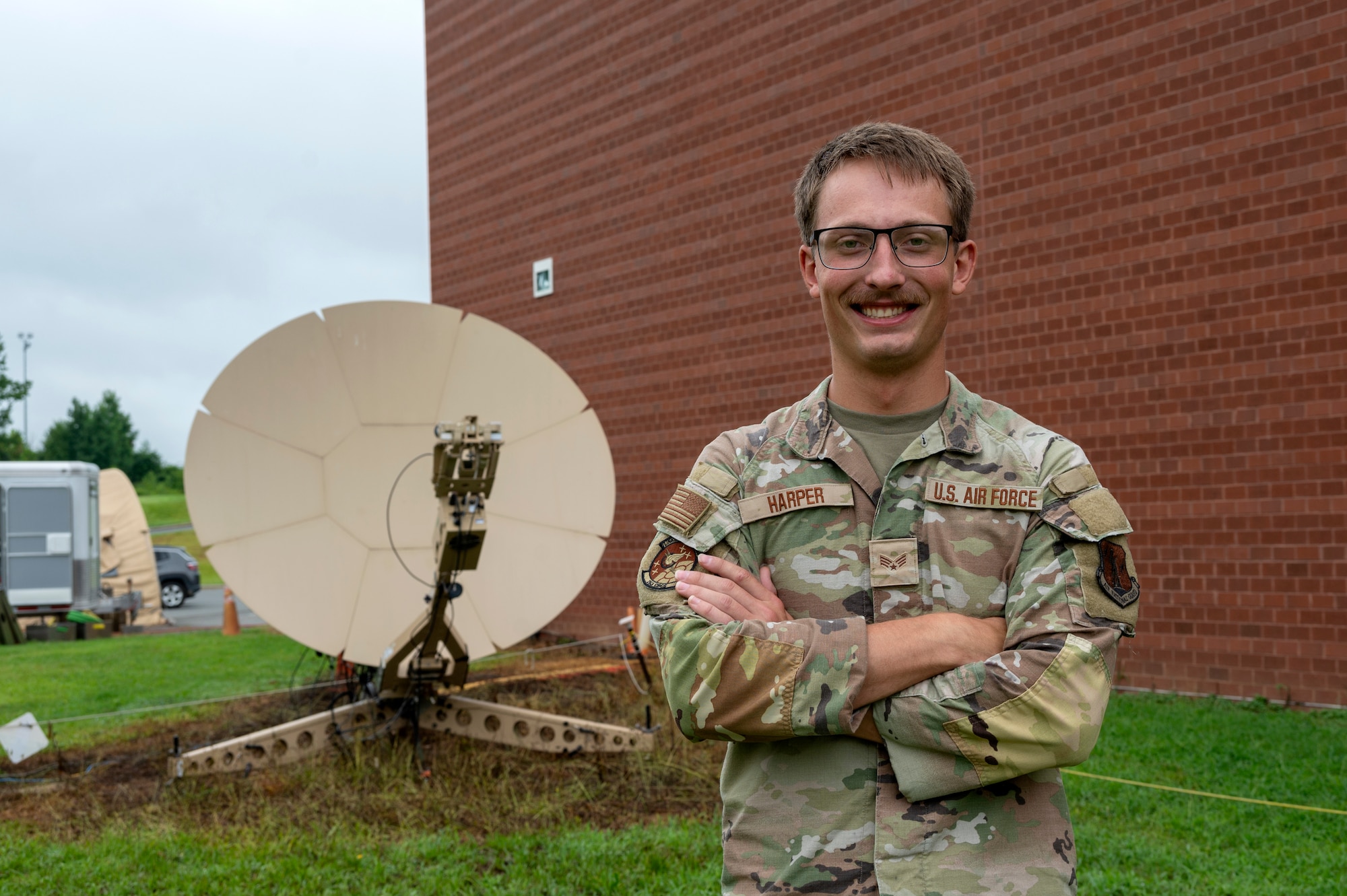U.S. Air Force Senior Airman Verlin K. Harper, 263rd Combat Communications Squadron radio-frequency transmission systems operator, poses for a photo at the New London Air National Guard base, N.C., August 1, 2025.