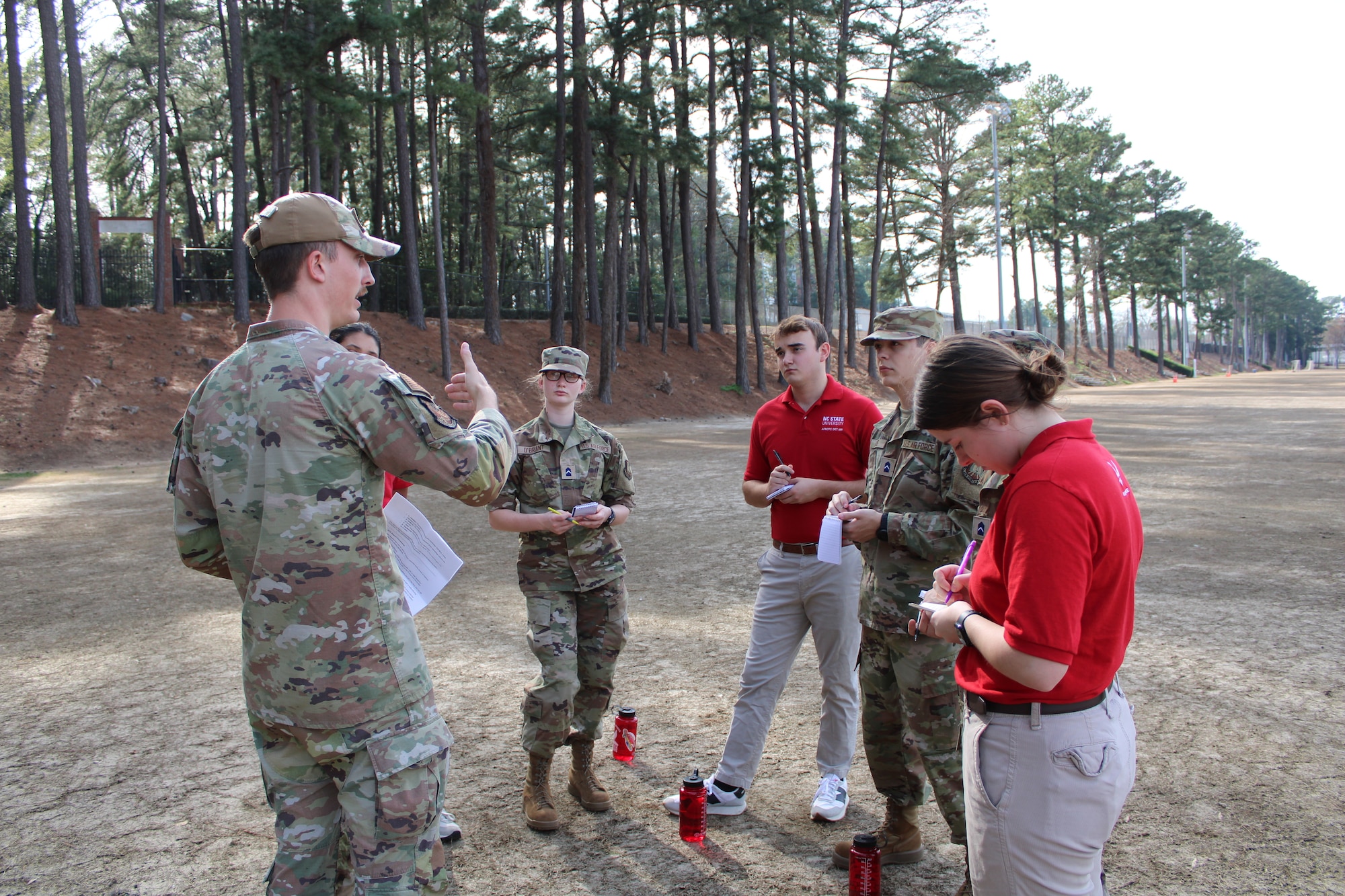 U.S. Air Force Senior Airman Verlin K. Harper, 263rd Combat Communications Squadron radio-frequency transmission systems operator, instructs Reserve Officers' Training Corps (ROTC) general military course cadets on expeditionary skills at N.C. State University, Sept. 4, 2024.