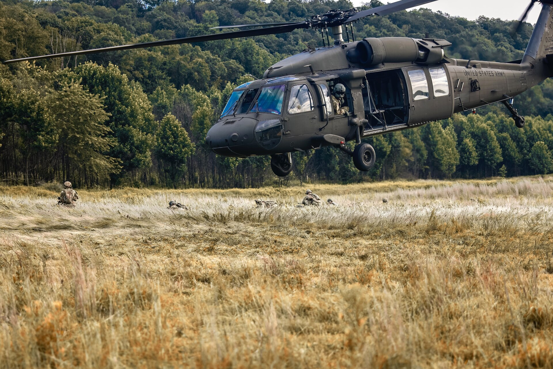 U.S. Soldiers with Charlie Company, 1st Battalion, 109th Infantry Regiment exit a UH-60 Black Hawk helicopter as they perform combat maneuvers during an exercise at Fort Indiantown Gap, Pennsylvania, July 29, 2025. The Soldiers trained in an intensive 96 hour force-on-force exercise to simulate combat against a capable adversary. (U.S. Army National Guard photo by Staff Sgt. Zachery Jockel)