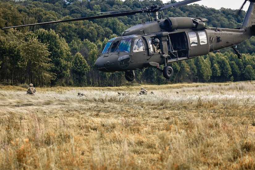 U.S. Soldiers with Charlie Company, 1st Battalion, 109th Infantry Regiment exit a UH-60 Black Hawk helicopter as they perform combat maneuvers during an exercise at Fort Indiantown Gap, Pennsylvania, July 29, 2025. The Soldiers trained in an intensive 96 hour force-on-force exercise to simulate combat against a capable adversary. (U.S. Army National Guard photo by Staff Sgt. Zachery Jockel)