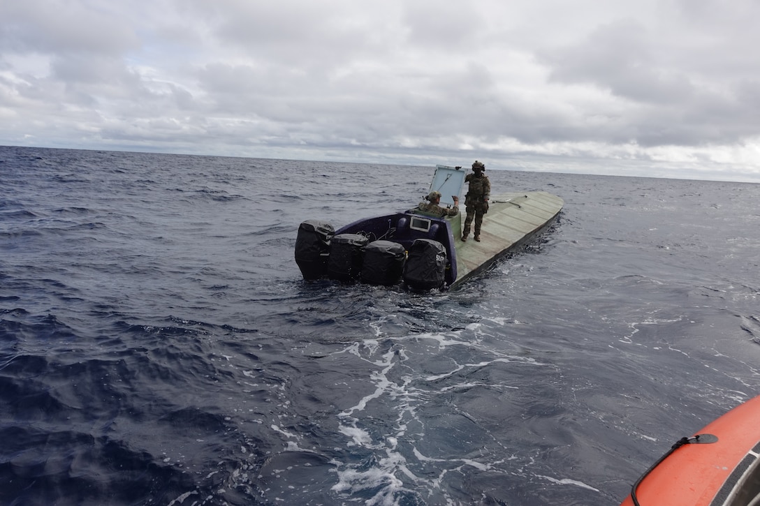 A U.S. Coast Guard Pacific Area Tactical Law Enforcement team member standing aboard a vessel suspected of drug smuggling in the eastern Pacific. The Coast Guard routinely patrols the eastern Pacific in support of counter-drug operations. (U.S. Coast Guard photo)