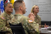 Col. Michelle M. Williams, U.S. Army Financial Management Command commander, gives opening remarks during a staff exercise as Col. Rob Le’iato, U.S. Army Finance and Comptroller School commandant (left), and Command Sgt. Maj. Craig A. Rodland, FCS senior enlisted advisor (middle), take part in the discussion at the Maj. Gen. Emmett J. Bean Federal Center in Indianapolis Oct. 28, 2024. USAFMCOM hosted the exercise to increase its operational capabilities through the four phases of the conflict continuum, reduce its inefficiencies in battle tasks, and clearly identify financial management roles, responsibilities and authorities. (U.S. Army photo by Mark R. W. Orders-Woempner)