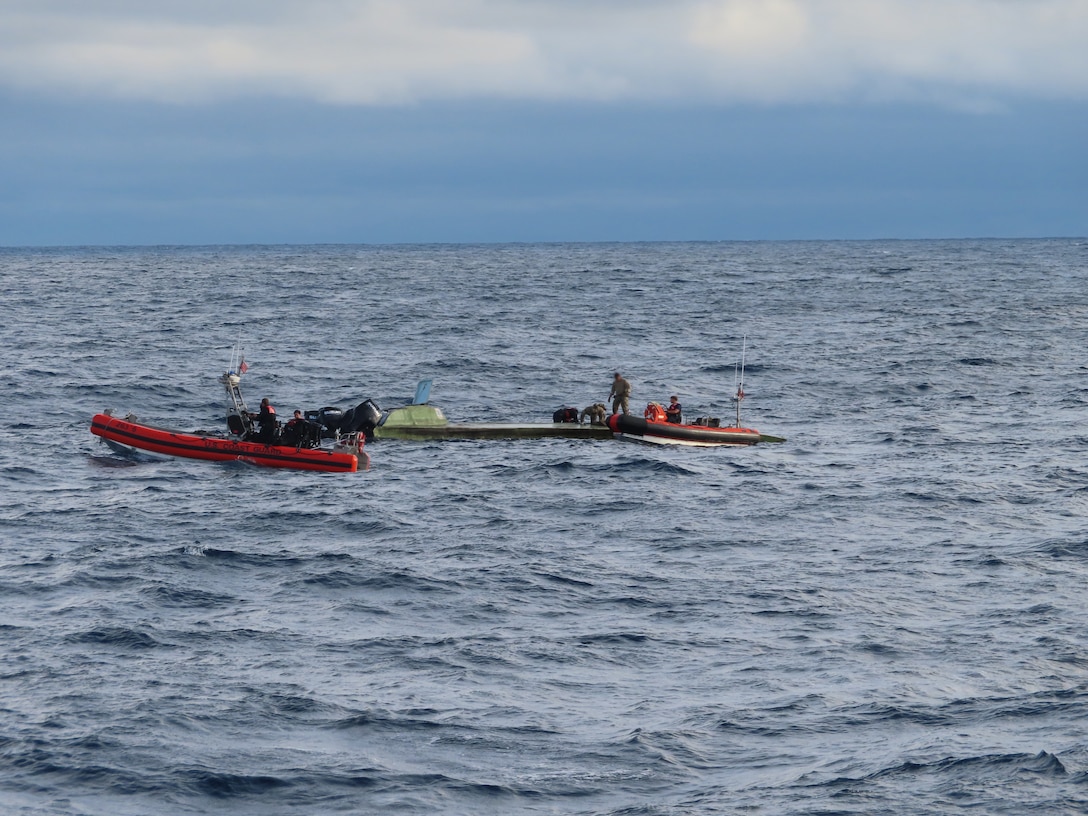 U.S. Coast Guard Cutter Escanaba (WMEC 907) boarding team searching a vessel suspected of drug smuggling in the eastern Pacific. A Coast Guard Pacific Area Tactical Law Enforcement crew and Helicopter Interdiction Tactical Squadron aircrew deployed with the Escanaba for tactical support during interdictions. (U.S. Coast Guard photo)