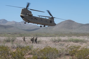 U.S. Airmen from the 14th Air Support Operation Squadron and U.S. soldiers assigned to 2nd Battalion, 12th Infantry Regiment, 2nd Brigade Combat Team, 4th Infantry Division, prepare to conduct exercise Desert Dragon in Pearce, Arizona, July 31, 2025. 14th ASOS Airmen conducted joint training with Army personnel to master air-to-ground integration and enhance operational readiness. (U.S. Air Force photo by Airman Jaden Kidd)