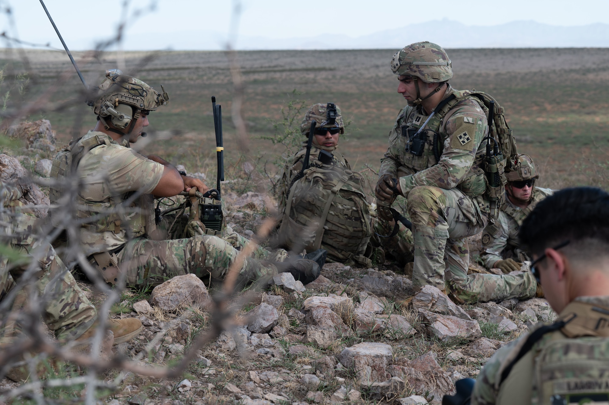 U.S. Air Force Staff Sgt. Christopher Benetti, 14th Air Support Operations Squadron joint terminal attack controller, left, works with U.S. Army Capt. Mohamed Elmaola, 2nd Battalion, 12 Infantry Regiment, 4 Stryker Brigade Combat Team, 4th Infantry Division battalion airborne operations officer, right, during exercise Desert Dragon in Pearce, Arizona, July 31, 2025. JTACs are trained to convey targets and relay battlespace awareness to pilots conducting close air support or other similar combat operations. (U.S. Air Force photo by Airman Jaden Kidd)