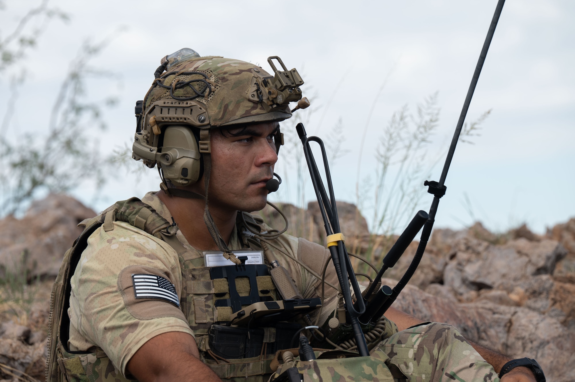 U.S. Air Force Staff Sgt. Christopher Benetti, 14th Air Support Operations Squadron joint terminal attack controller, uses communication equipment during exercise Desert Dragon in Pearce, Arizona, July 31, 2025. Benetti acted as the link between two ground force commanders and an aircraft pilot to accomplish exercise objectives. (U.S. Air Force photo by Airman Jaden Kidd)