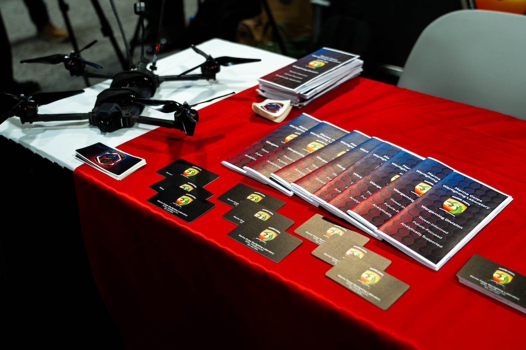 Items are displayed at the Marine Corps Warfighting Laboratory's booth during Modern Day Marine at the Walter E. Washington Convention Center, Washington D.C., April 30th, 2025. Modern Day Marine is a military exposition exclusively organized for the Marine Corps to showcase the newest technology and warfighting innovations from amphibious assault vehicles to drones and more. (U.S. Marine Corps photo by Connor Taggart)