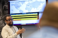 Paul Jackson, U.S. Army Financial Management Command security manager, provides an operational environment update during a staff exercise at the Maj. Gen. Emmett J. Bean Federal Center in Indianapolis Oct. 29, 2024. USAFMCOM hosted the exercise to increase its operational capabilities through the four phases of the conflict continuum, reduce its inefficiencies in battle tasks, and clearly identify financial management roles, responsibilities and authorities. (U.S. Army photo by Mark R. W. Orders-Woempner)
