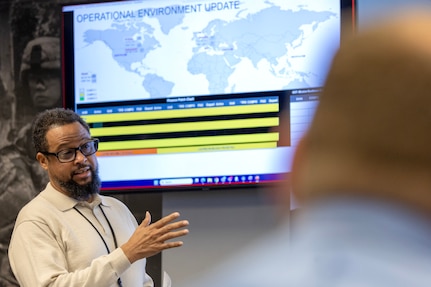 Paul Jackson, U.S. Army Financial Management Command security manager, provides an operational environment update during a staff exercise at the Maj. Gen. Emmett J. Bean Federal Center in Indianapolis Oct. 29, 2024. USAFMCOM hosted the exercise to increase its operational capabilities through the four phases of the conflict continuum, reduce its inefficiencies in battle tasks, and clearly identify financial management roles, responsibilities and authorities. (U.S. Army photo by Mark R. W. Orders-Woempner)