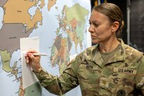 Maj. Sonja Keith, 45th Finance Center Chief of Operations, makes notes during a staff exercise at the Maj. Gen. Emmett J. Bean Federal Center in Indianapolis Oct. 30, 2024. The U.S. Army Financial Management Command hosted the exercise to increase its operational capabilities through the four phases of the conflict continuum, reduce its inefficiencies in battle tasks, and clearly identify financial management roles, responsibilities and authorities. (U.S. Army photo by Mark R. W. Orders-Woempner)