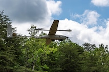 U.S. Marines with Marine Corps Advisor Company-A (MCAC-A) learn the capabilities and limitations of unmanned aerial systems (UAS) assets at Camp Upshur, Marine Corps Base Quantico, Va., May 15, 2025. Members of the Marine Corps Warfighting Laboratory support and educate MCAC-A Marines on UAS assets to increase their ability to advise and support foreign security forces. (U.S. Marine Corps photo by Connor Taggart)