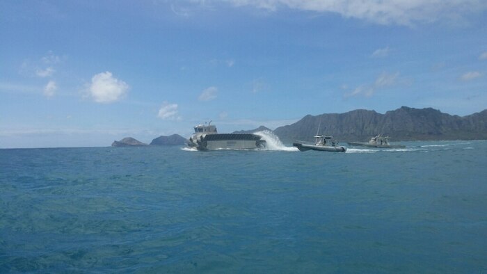 The Ultra Heavy-Lift Amphibious Connector makes its way toward the USS Rushmore to pick up heavy logistics gear and ITV to support operations on Marine Corps Training Area Bellows, Hawaii, during the Marine Corps Warfighting Lab’s Advanced Warfare Experiment, July 11, 2014. (Marine Corps Photo by Cpl. Matthew J. Bragg)