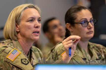 Col. Michelle M. Williams, U.S. Army Financial Management Command commander, provides direction at a battle update brief as Sgt. Maj. Julie Harris, USAFMCOM Operations senior enlisted advisor, listens on during a staff exercise at the Maj. Gen. Emmett J. Bean Federal Center in Indianapolis Oct. 30, 2024. USAFMCOM hosted the exercise to increase its operational capabilities through the four phases of the conflict continuum, reduce its inefficiencies in battle tasks, and clearly identify financial management roles, responsibilities and authorities. (U.S. Army photo by Mark R. W. Orders-Woempner)