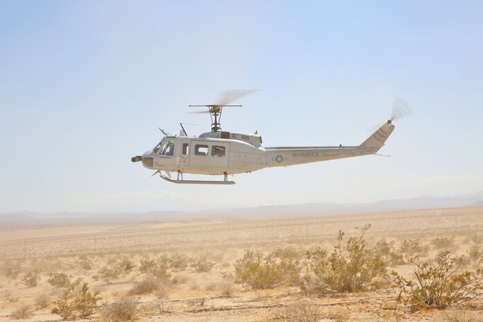 Autonomous Aerial Cargo Utility System (AACUS) provides a material resupply for Marines assigned to Combat Logistics Battalion 8, based at Marine Corps Base Camp Lejeune, NC during the Marine Corps Warfighting Lab Expeditionary Hybrid Logistics experiment conducted in conjunction with Integrated Training Exercise 3-18 at Marine Air Ground Combat Center, Twentynine Palms, CA, May 14, 2018. During this experiment, AACUS successfully conducted multiple resupply missions of varying distance and payload, and received fuel from a forward aerial refuel point (FARP). Both events were firsts for the program.