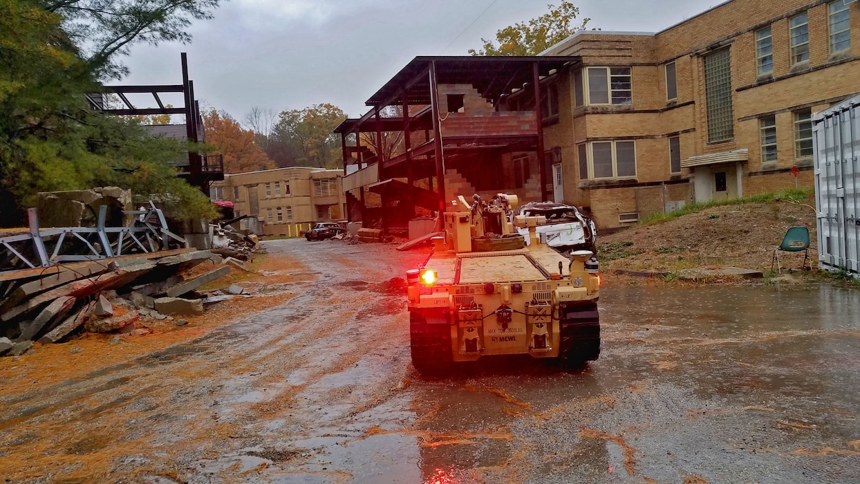 The Marine Corps Warfighting Laboratory executed a Manned and Unmanned Teaming Limited Operational Assessment (MUM-T LOA) at Muscatatuck Urban Training Center (MUTC), Indiana. The MUM-T LOA aimed to effectively combine robotics, sensors, manned/unmanned vehicles, and dismounted Marines with the goal of achieving greater mission effectiveness through enhanced situational awareness, greater lethality, improved survivability, and logistics sustainment. The event included controlled platoon and company-sized scenarios comprised of twenty-five total events, executed by Marines assigned to Echo Company, 2nd Battalion, 6th Marine Regiment.