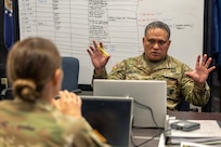 Col. Rob Le’iato, U.S. Army Finance and Comptroller School commandant, has a discussion during a staff exercise at the Maj. Gen. Emmett J. Bean Federal Center in Indianapolis Oct. 31, 2024. The U.S. Army Financial Management Command hosted the exercise to increase its operational capabilities through the four phases of the conflict continuum, reduce its inefficiencies in battle tasks, and clearly identify financial management roles, responsibilities and authorities. (U.S. Army photo by Mark R. W. Orders-Woempner)