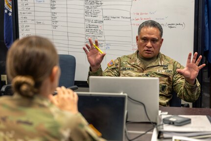 Col. Rob Le’iato, U.S. Army Finance and Comptroller School commandant, has a discussion during a staff exercise at the Maj. Gen. Emmett J. Bean Federal Center in Indianapolis Oct. 31, 2024. The U.S. Army Financial Management Command hosted the exercise to increase its operational capabilities through the four phases of the conflict continuum, reduce its inefficiencies in battle tasks, and clearly identify financial management roles, responsibilities and authorities. (U.S. Army photo by Mark R. W. Orders-Woempner)
